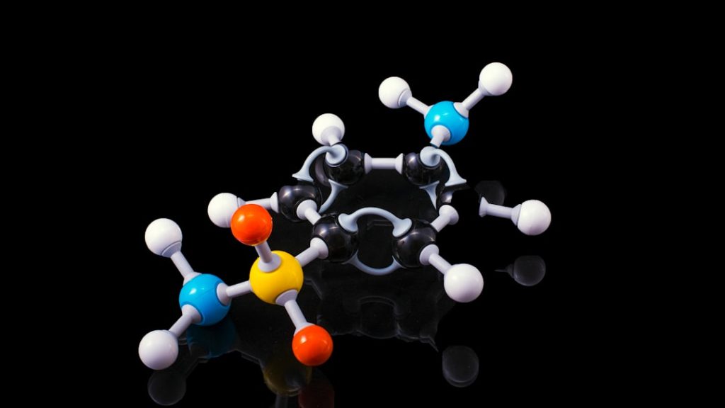 Molecular model of a peptide structure with colorful spheres representing different elements