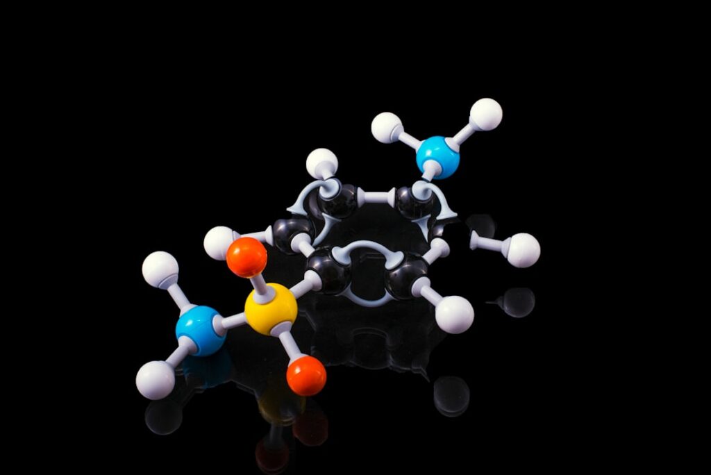 Molecular model of a peptide structure with colorful spheres representing different elements