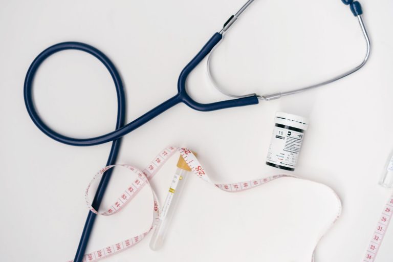 Flat lay of medical tools including stethoscope and measuring tape on a white background. — The Benefits of Using Hair, Skin,