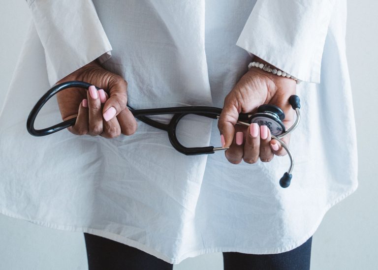 A medical professional holding a stethoscope in a clinical setting. — Ultra: Elevate Your Workouts with Enhanced Performance